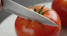 knife glides on tomato